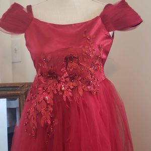A beautiful red formal dress for a small little girl size 12 off the shoulders